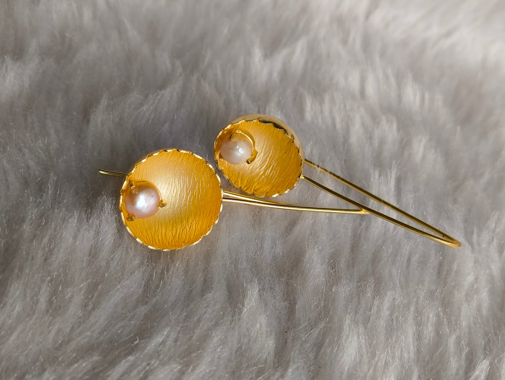 Pearl in Brass